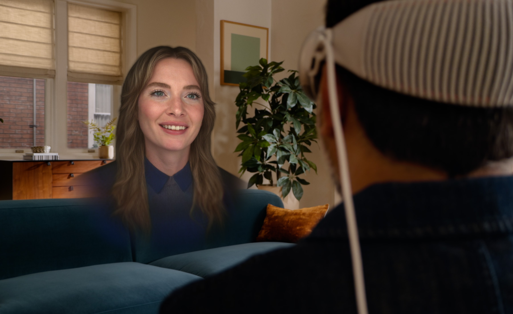 A life-size spatial Persona facing a person wearing Apple Vision Pro